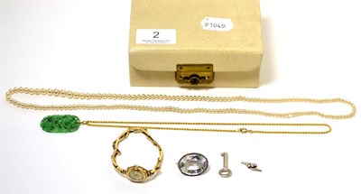Lot 2 - A 9 carat gold watch, a carved jade pendant on chain stamped '9CT', etc