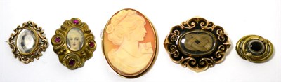 Lot 23 - A shell cameo brooch and three mourning brooches (4)