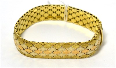 Lot 32 - A tri-colour bracelet