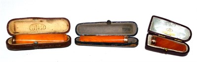 Lot 69 - A 9 carat gold mounted amber Cheroot holder, Birmingham 1924, 5.2cm long, in a fitted leather case