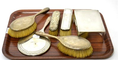 Lot 105 - A silver cigarette box; and a group of silver dressing table brushes etc