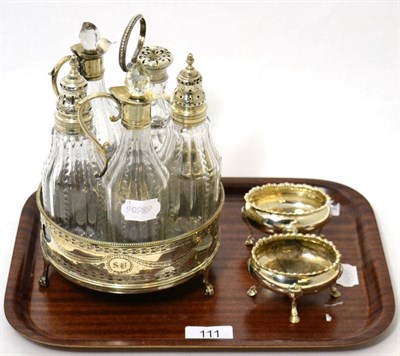 Lot 111 - A George III silver cruet stand, circular form with pierced sides, one bottle associated;...