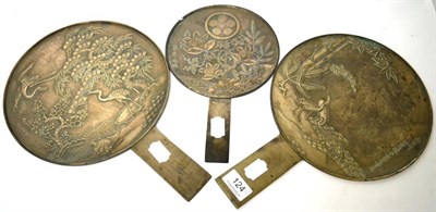 Lot 124 - Three Japanese Meiji period bronze bound mirrors, each signed