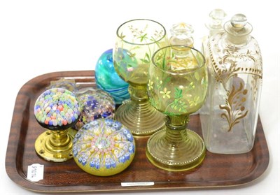 Lot 128 - Three 19th century gilt decorated bottles, a group of millefiori paperweights and others, etc