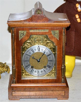 Lot 150 - An oak cased mantel clock