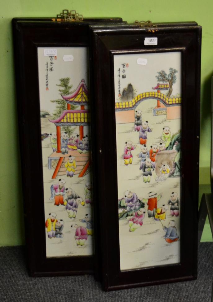 Lot 185 - A set of four Chinese polychrome porcelain panels decorated with children, each in hard wood frames