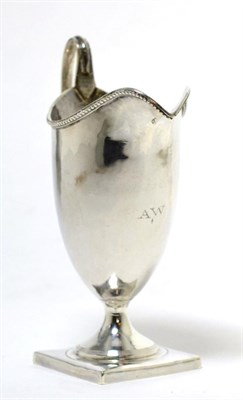 Lot 190 - A George III silver helmet form cream jug, London