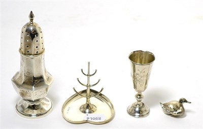 Lot 205 - A group of silver items comprising; an octagonal pedestal caster; a ring tree with heart shaped...