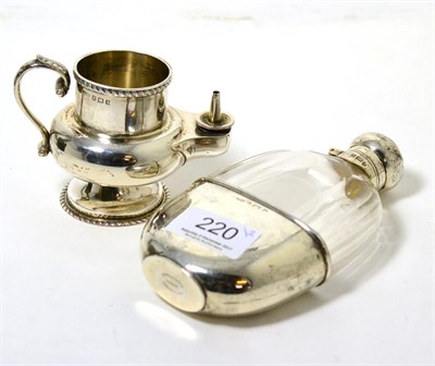 Lot 220 - A silver mounted glass hip flask, Birmingham 1900; together with a silver table lighter
