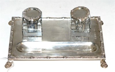 Lot 256 - A silver inkstand with two glass ink pots, decorated with a Celtic border, Birmingham, 1935