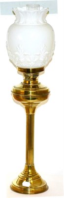Lot 273 - A brass column oil lamp with a milk glass coloured shade