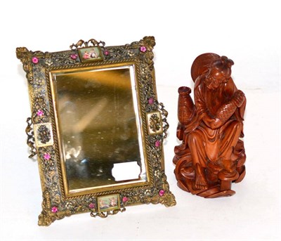 Lot 275 - A Chinese carved hardwood figure of a fisherman and a paste set gilt metal framed small easel...