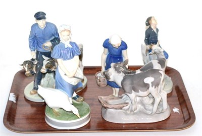 Lot 277 - Four Royal Copenhagen figure groups comprising: milkmaid and cows (number 2270), boy and cows...