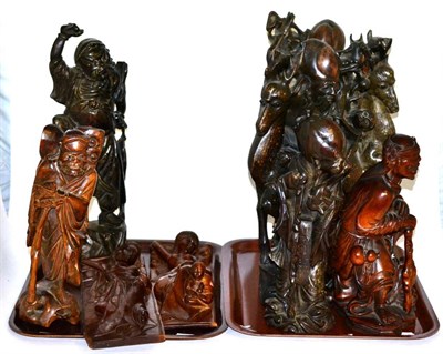 Lot 298 - ^ Eight oriental carved wooden figures