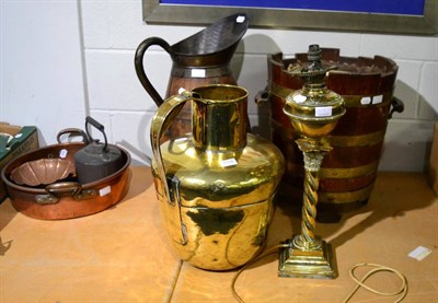 Lot 1108 - ^ A coopered oak harvest jug, a similar jardiniere, a large brass jug and a brass oil lamp