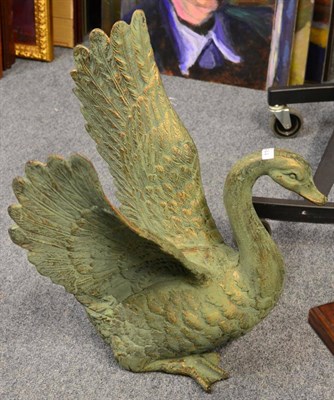 Lot 1153 - A cast metal model of a swan with wings outstretched