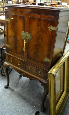 Lot 1166 - A mahogany reproduction two door cocktail cabinet