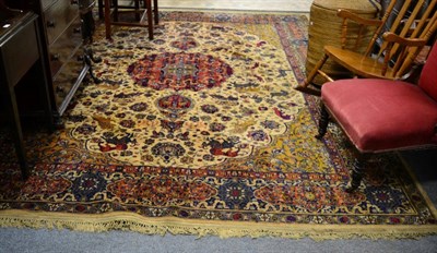 Lot 1172 - Machine made carpet of Persian hunting design, the ivory field with plamettes and vines centred...