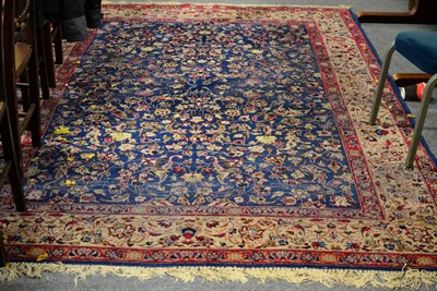 Lot 1173 - Mashad carpet, North east Iran, the sky blue field of leafy vines enclosed by ivory floral borders