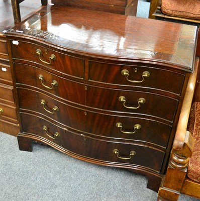 Lot 1176 - A reproduction mahogany serpentine fronted four height chest of drawers