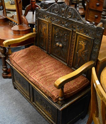 Lot 1190 - ^ A carved oak box settle&nbsp