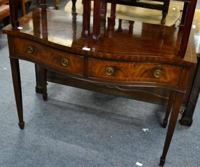 Lot 1206 - An Edwardian mahogany serpentine sideboard