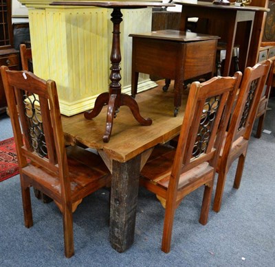 Lot 1210 - A rustic hardwood dining table and six modern hardwood chairs