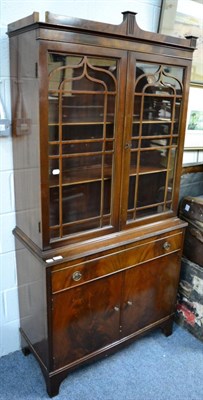 Lot 1221 - A mahogany bookcase cabinet