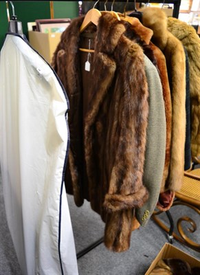 Lot 1235 - Dark brown long musquash coat together with a 1980's cut mink and leather jacket with leather...