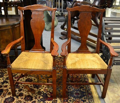 Lot 1236 - A pair of mahogany elbow chairs