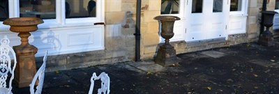 Lot 1238 - Two cast iron urns and one terracotta urn