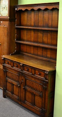 Lot 1245 - An oak dresser and rack