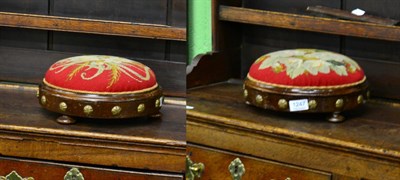 Lot 1247 - Two Victorian walnut circular footstools with brass mounts