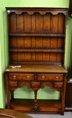 Lot 1250 - An oak dresser and rack of small proportions