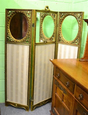 Lot 1259 - A giltwood mirrored three sectional folding screen