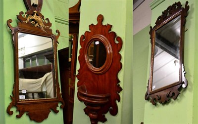 Lot 1262 - Two George III mahogany fret-work mirrors, one surmounted with a ho-ho bird together with a...