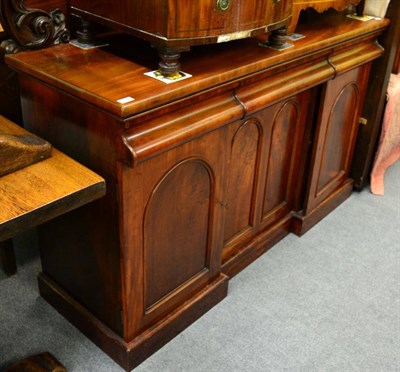 Lot 1272 - A 19th century mahogany sideboard with carved up-stand