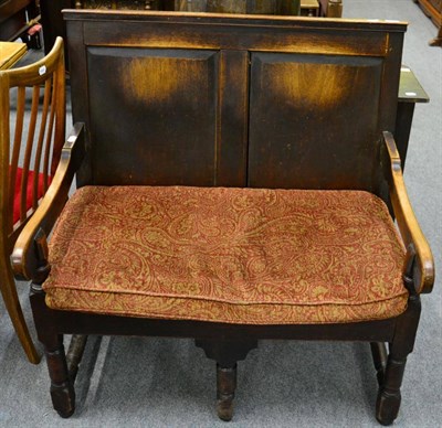 Lot 1284 - ^ A 19th century two panel oak settle of small proportions