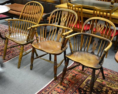 Lot 1290 - ^ An elm stick back Windsor chair, an open elm Windsor armchair and another (3)