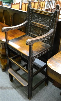 Lot 1295 - ^ A reproduction carved oak bar chair in 17th century style, with carved bust finals and lion...