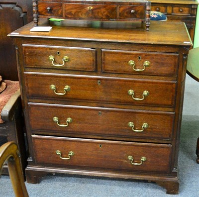 Lot 1301 - A George III oak four height chest of drawers, two short above three long drawers flanked by...