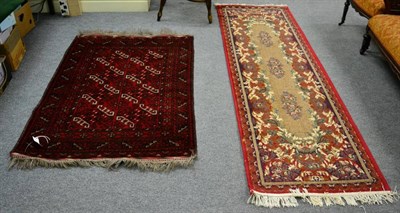 Lot 1313 - A dark red ground rug; and another smaller rug (2)