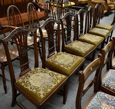 Lot 1322 - Six George III style mahogany chairs with tapestry seats