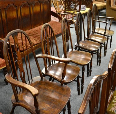 Lot 1323 - A set of six stick back elm Windsor chairs including two carvers