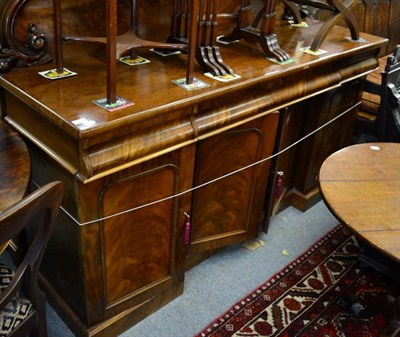 Lot 1335 - A Victorian mahogany sideboard with shaped carved back