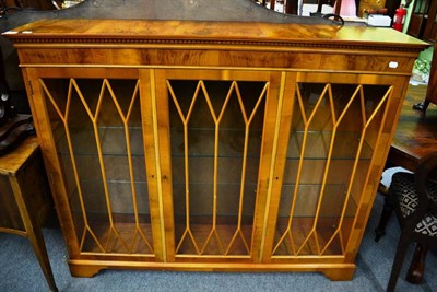 Lot 1340 - A reproduction yew wood display cabinet