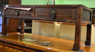 Lot 1346 - A Chinese hardwood coffee table fitted with two drawers