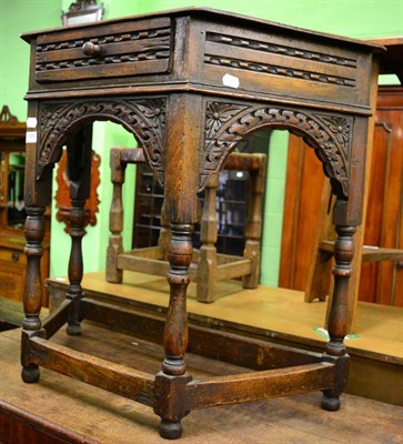 Lot 1359 - ^ A carved oak side table