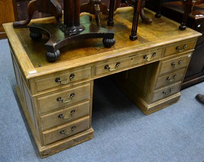 Lot 1364 - A leather inset pine pedestal desk