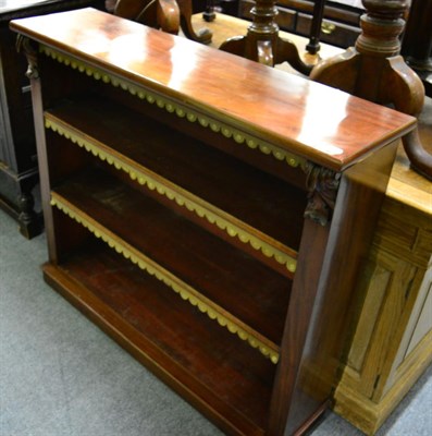 Lot 1366 - A mahogany three tier open bookcase